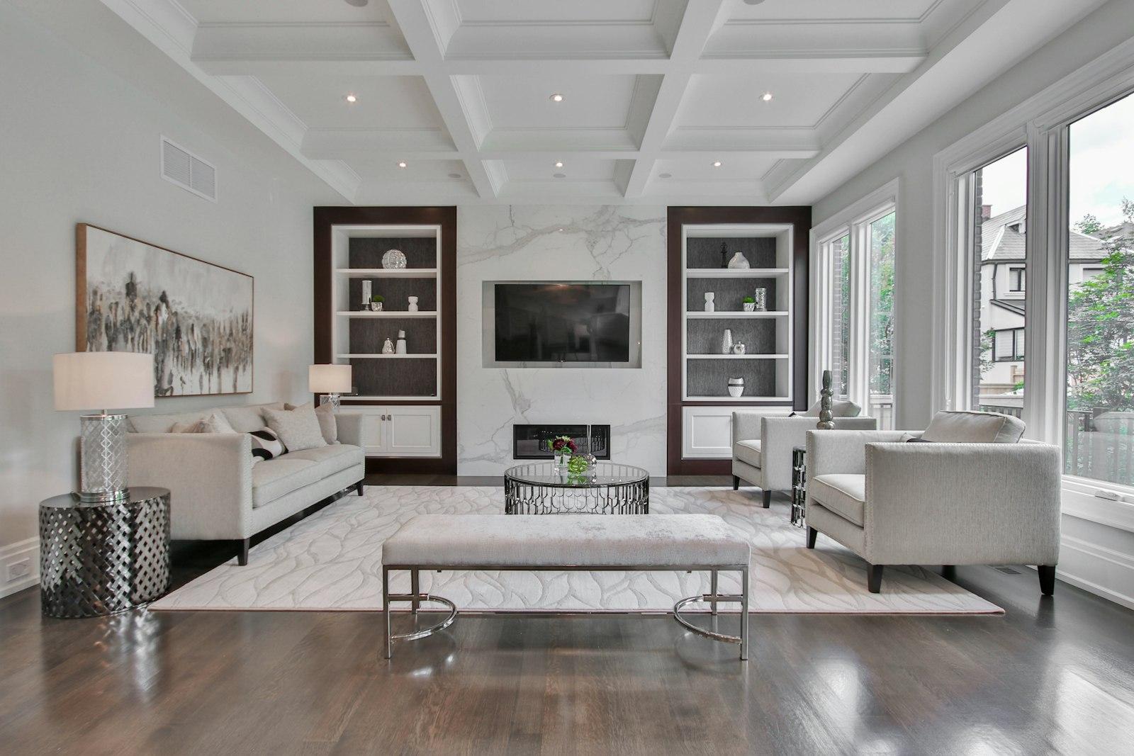 Bright living room with marble and built-in shelves